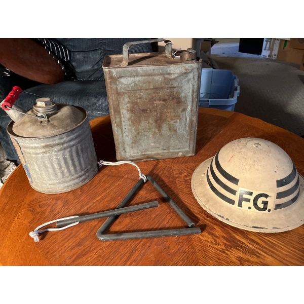 Antique gas, cans, helmet, and dinner triangle that sounds awesome