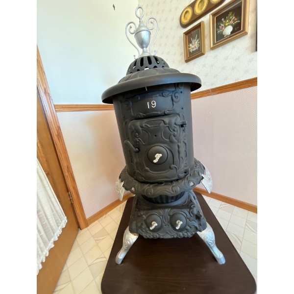  antique cast iron parlor stove,# 19 in great condition. Must bring help to move .