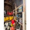 Image 4 : several barrels of oil, gas cans, both diesel and unleaded vintage oil cans. 