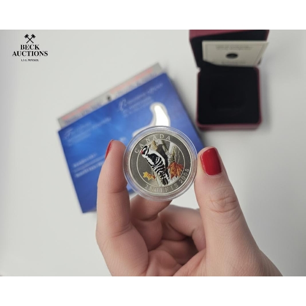 2008 Canadian 25-Cent Colorized Coin the Downy Woodpecker from the "Birds of Canada" series. 