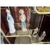 Image 4 : Collection of vintage figurines, dolls, and decorative items displayed on a brass and glass etagere,