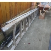 Image 1 : Aluminum Extension Ladder, Steel Wheelbarrow, and Metal Tow Bars Lot