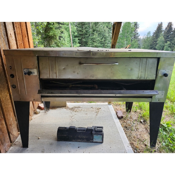 Bakers Pride Gas Pizza Oven 
77.75 X 43" 
59.5" Backing Space 
Needs Some Love 
