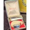 Image 9 : Decorative Clocks, Philishave Razor, and Peacock Artwork Display
