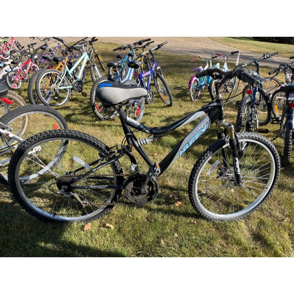 ladies HUFFY tundra full suspension with front disc brakes .