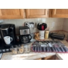 Image 1 : Several Kitchen Items. Vintage Pyrex Measuring Bowls, Utensils, Keurig and Coffee Maker, Sandwich Pr