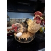 Image 1 :  serving dishes with rooster and hand in basket, laying an egg