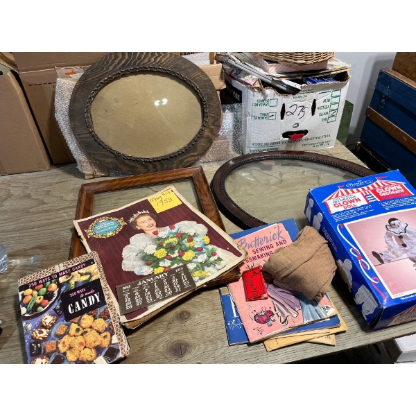 Three vintage picture frames one has a oval dome glass picture frame including a May 30, 1953 daily 