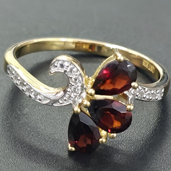 TWO-TONE GARNET AND DIAMOND-ACCENT BYPASS RING