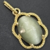 Image 1 : OVAL CAT'S EYE CHRYSOBERYL/QUARTZ GOLD FRAME PENDANT 