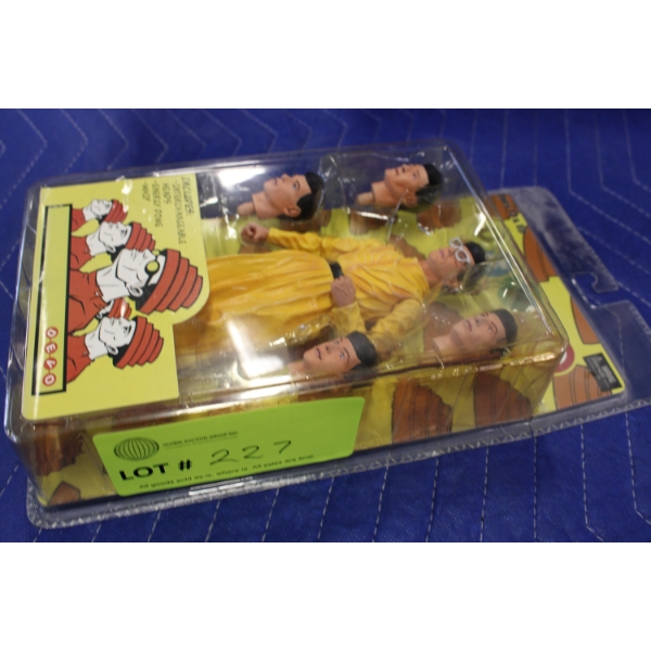 Devo Action Figure with Multiple Heads in Original Packaging
