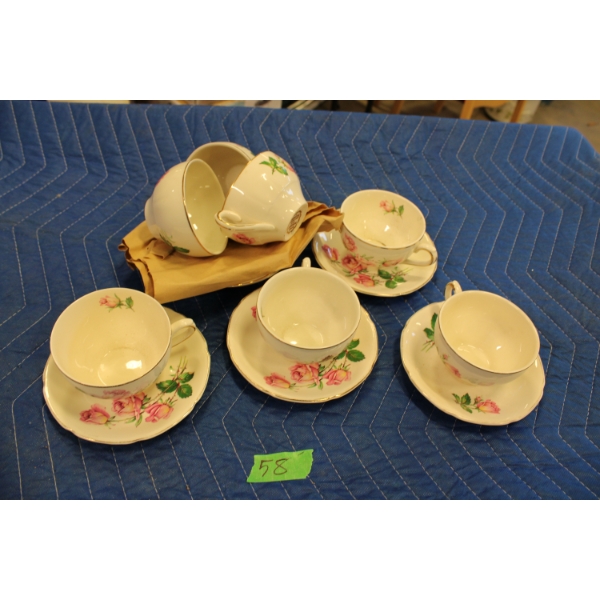 Set of Seven Tea Cups and Saucers