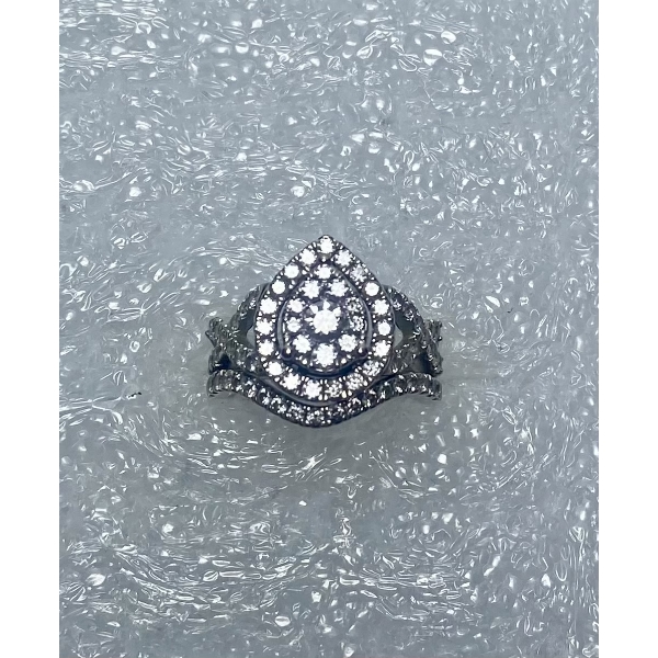 Lady's 14kt White Gold Ring with Pear Shaped Halo Cluster Diamond setting
1 Round Brilliant Cut Diam