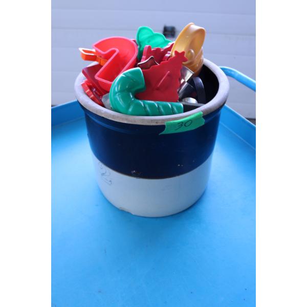 2 Gallon Ceramic Crock Pot filled with various cookie cutters