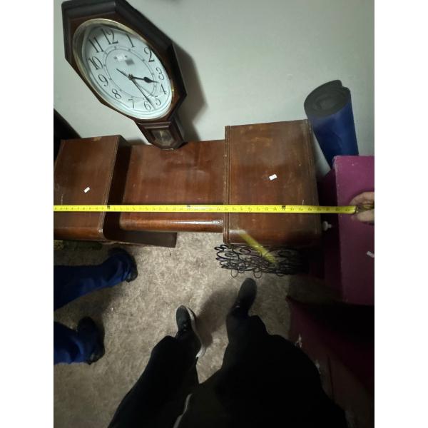  Traditional schoolhouse pendulum wall clock with a Westminster chime function. 