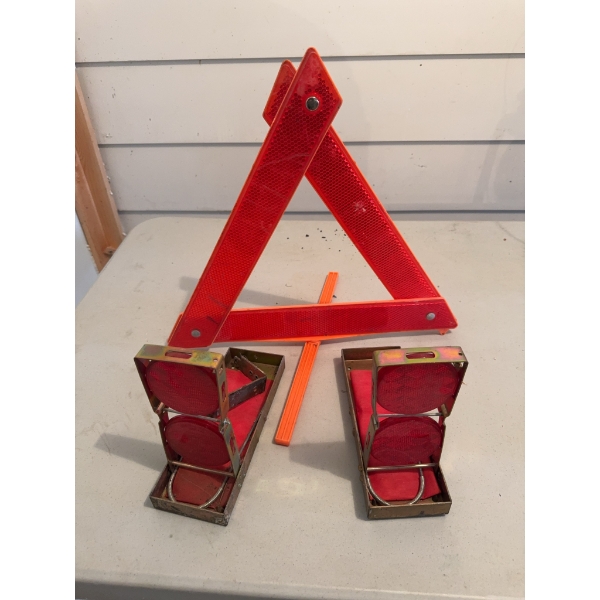 One reflective warning triangle and two vintage metal road flares with red reflective panels. Suitab
