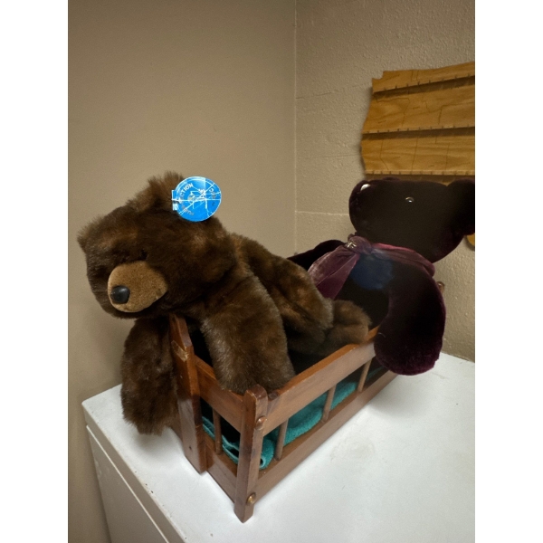 Wooden cradle with very soft teddy bears. Very nice.
