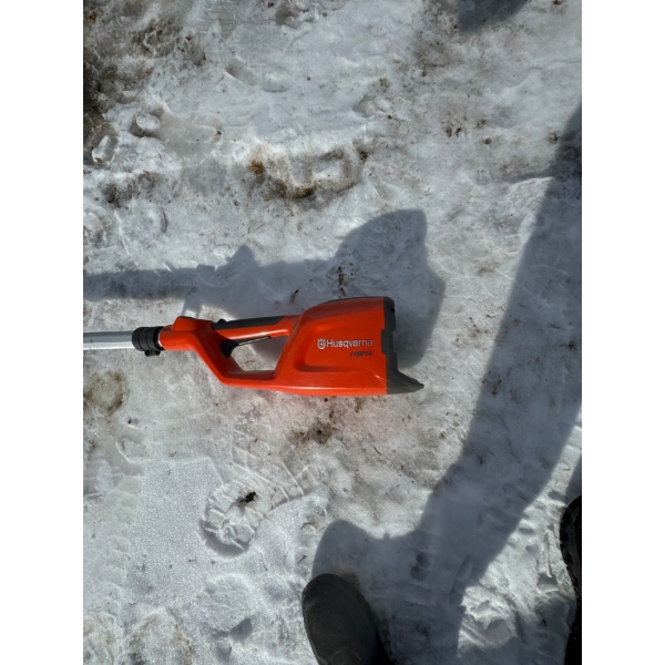  Husqvarna 120iTK4-PH battery-powered telescopic pole saw and hedge trimmer combination tool.  Model