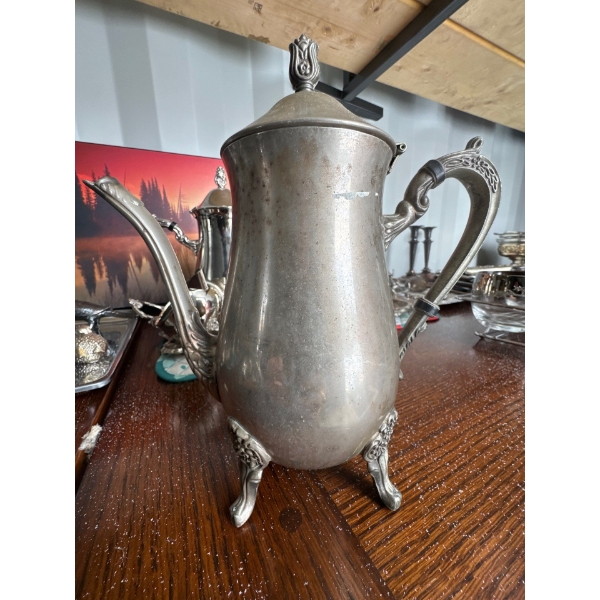 vintage, silver-plated footed coffee or teapot, likely manufactured in the mid-20th century, and oft