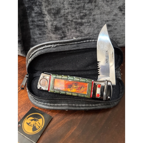  Franklin Mint Collector Pocketknife featuring Vietnam War era artwork, such as the M113 APC Tanker 