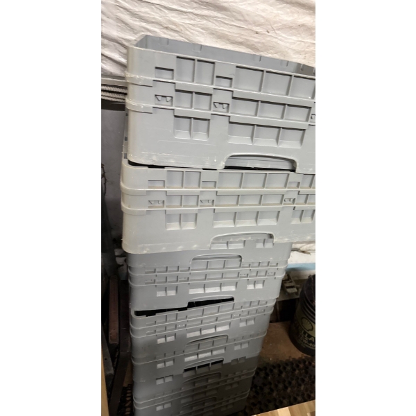 Assorted barware glasses, short and tall with dishwasher, racks and pizza pans for a restaurant