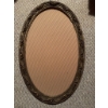 Image 3 : Oval metal frame with decorative floral design, containing a black and white photographic portrait o