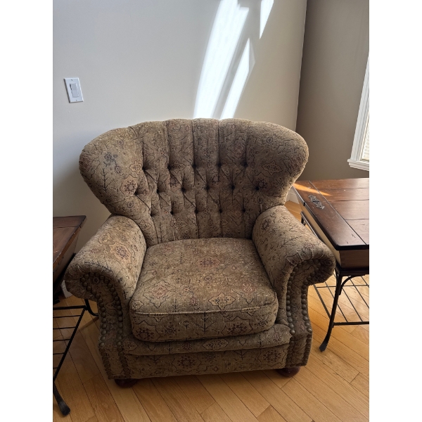 #2 traditional-style armchair featuring a tufted wingback design, rolled arms, and decorative nailhe