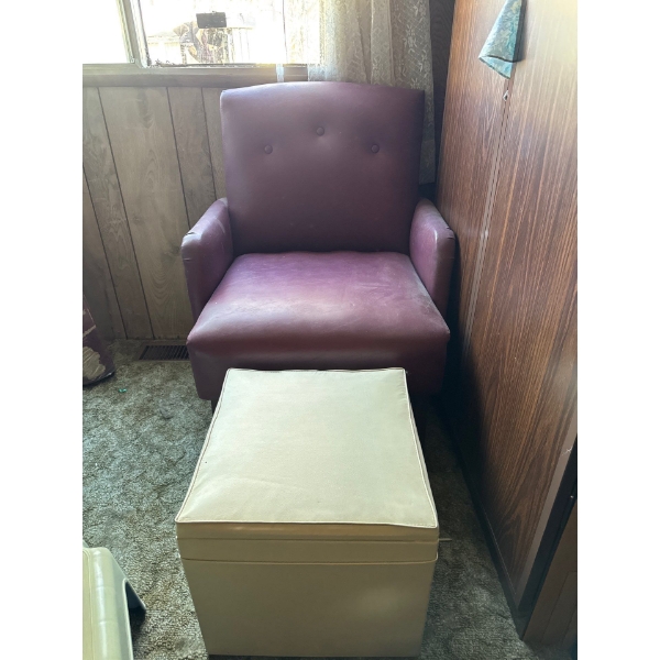 This is a mid-century modern style armchair with an accompanying ottoman. 