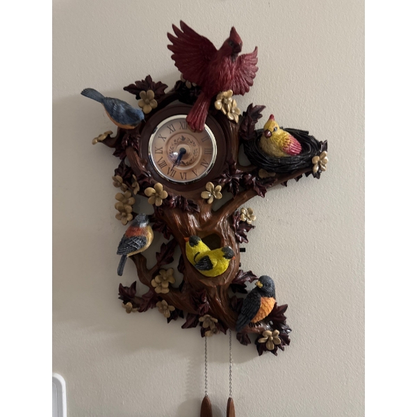 Treetop Chorus Songbird Sculptural Wall Clock by The Bradford Exchange. 
Inspired by Bavarian collec