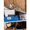 Image 3 : All four racks and their contents, featuring an air nailer, miscellaneous items, nails, and more. Ev