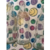 Image 7 : White wicker baby bassinet with folding legs, lace trim, fitted colorful smiley face fabric, and thr