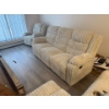 Image 2 :  contemporary-style sofa,  featuring a light-colored ribbed corduroy fabric. reclining