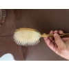Image 3 : Gold-tone decorative hairbrush featuring ornate detailing on the back and handle and synthetic brist