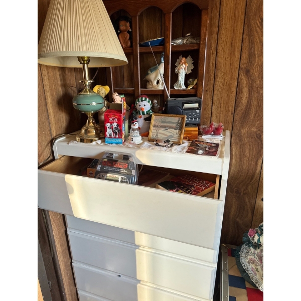 white dresser, full of books, Alberta ghost stories, Sudoku game, lots of figurines, and display sh