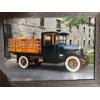 Image 1 :  photograph of a vintage International truck, likely dating back to the late 1920s, featuring a wood