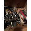 Image 4 : Variety of kitchen utensils, such as stainless steel egg beaters, kitchen knives with black handles,