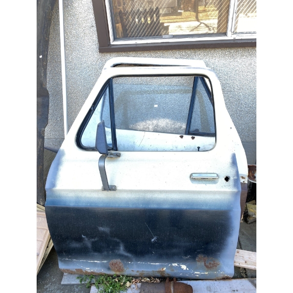 2 doors off 1970s Ford with the fibreglass front visor and door panels