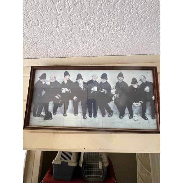 A vintage framed print titled "Nine Pints of the Law" by British artist Lawson Wood, featuring nine 