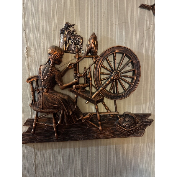 This is a vintage 1971 Coppercraft Guild "Spinning Jenny" wall hanging made by Dart Industries. 
It 