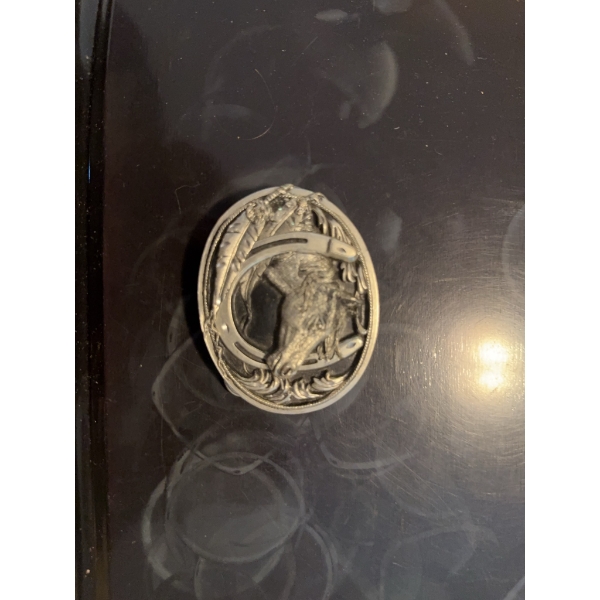  belt buckle featuring a raised horse head design, horseshoe, and wheat motif. The piece has an oval