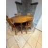 Image 2 :  vintage dining set includes a round maple wood table matching spindle-back chairs. 