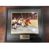 Image 2 :  framed sports collectible is titled "A Clash of Titans" and features autographed images of hockey l