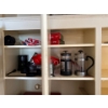 Image 2 : Items in the 3 cupboards left of the sink are all included. Including some French presses, 