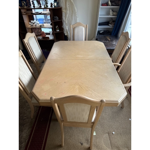 light-wood dining table and chairs set, which is expandable if needed. 