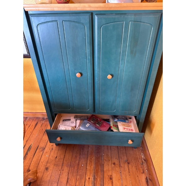 This item is a green Ethan Allen TV armoire featuring two doors for storage above two drawers, it is