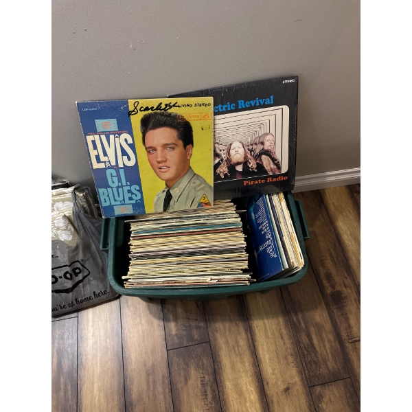 Large rubbermaid bin full of records including Elvis and other hit records