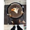 Image 1 :  decorative dreamcatcher featuring a prominent eagle head design and fur-like texture, commonly used