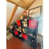 Image 1 : cubby with books on England, ,, leather belts,and more