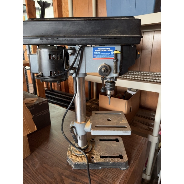King Canada drill press with metal construction and wired motor. Also contains various hand tools, a