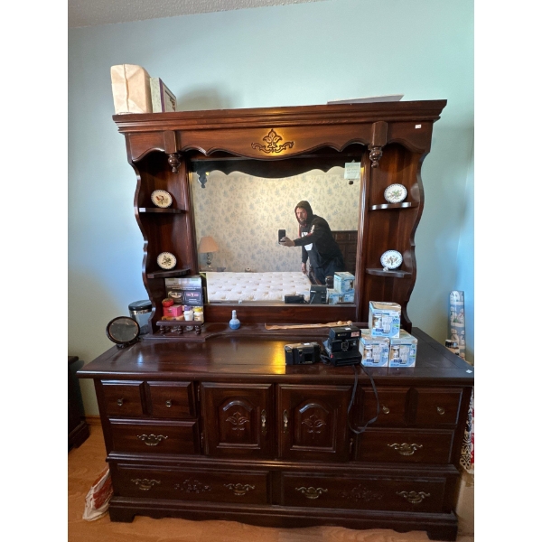 Dresser and mirror all contents in dresser included 63 inches long by 74 inches high, including mirr